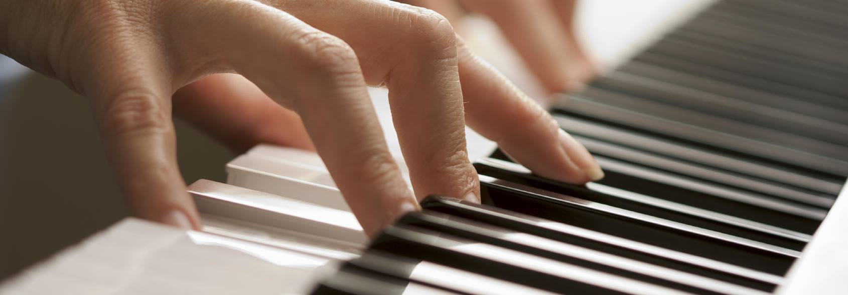 Playing piano closeup